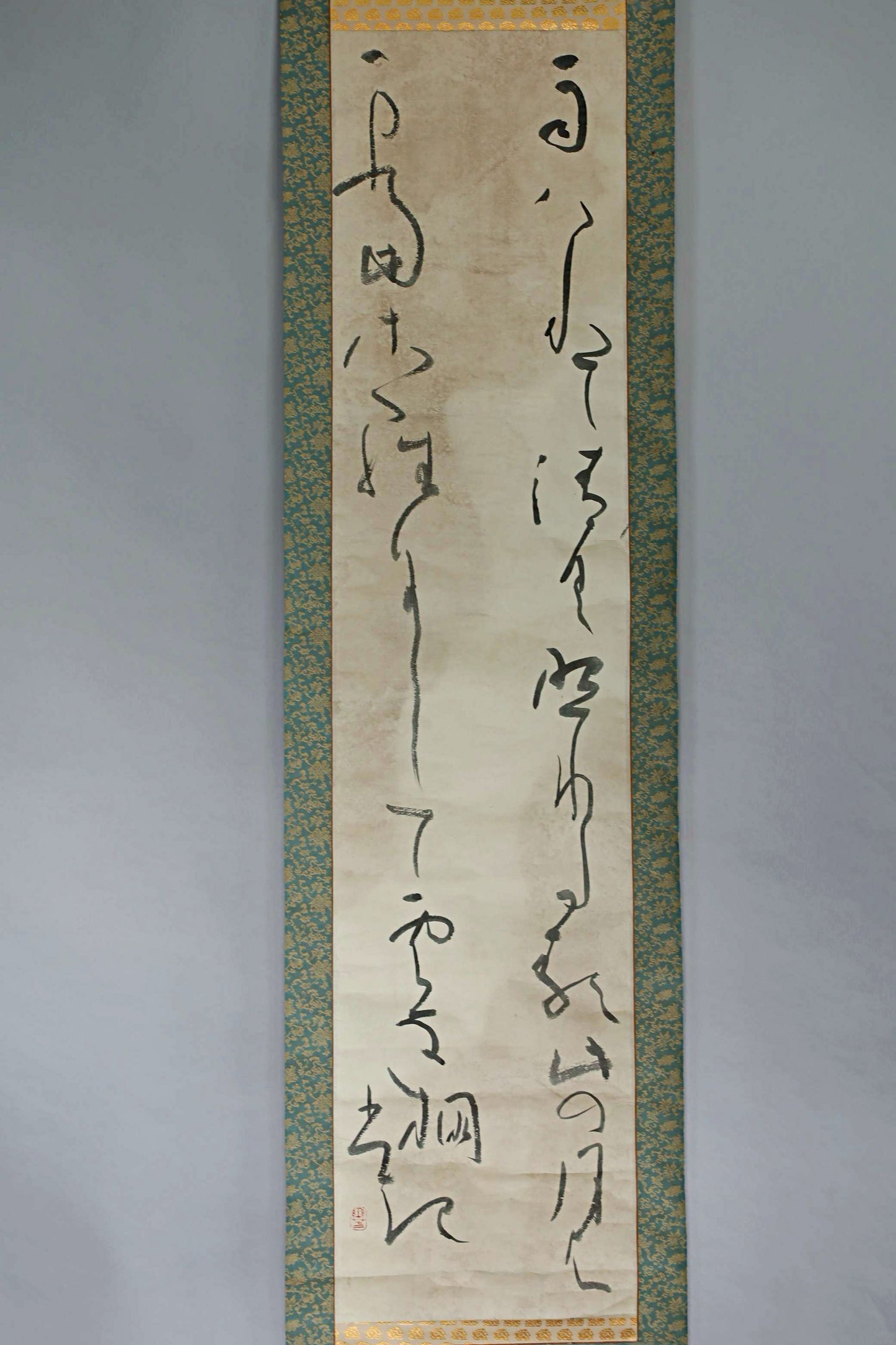 a vertical scroll with Chinese characters on it.