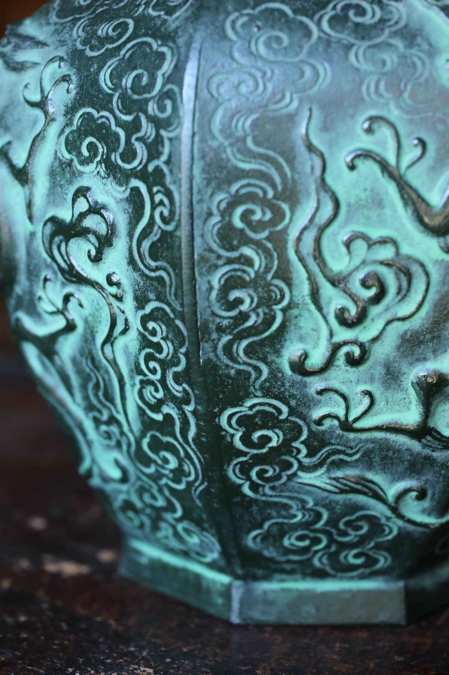 a close-up view of a decorative metal object with intricate swirling patterns and designs.