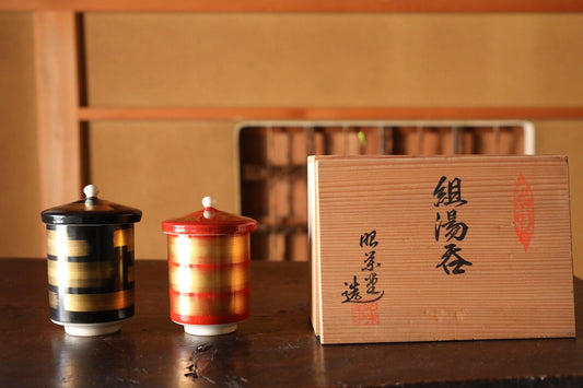Japanese pair of Kutani porcelain tea cups with lids, black and Red with Gold, with a kiln signature, H4.3×W2.9in/H11×W7.4cm