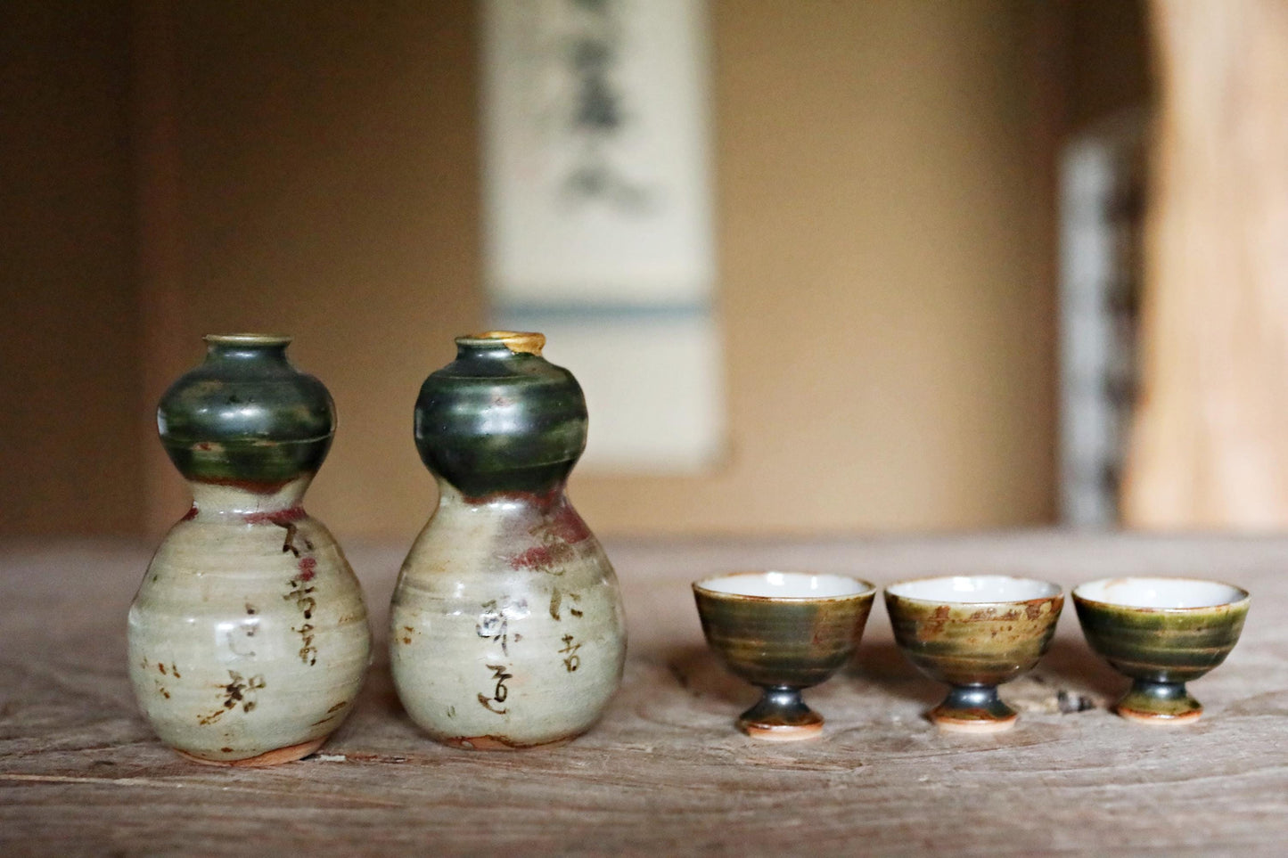 A pair of Kintsugi Tokkuri bottles and cups, Japanese antique porcelain sake bottle and cups with old words in Kanji H3.9in/10cm