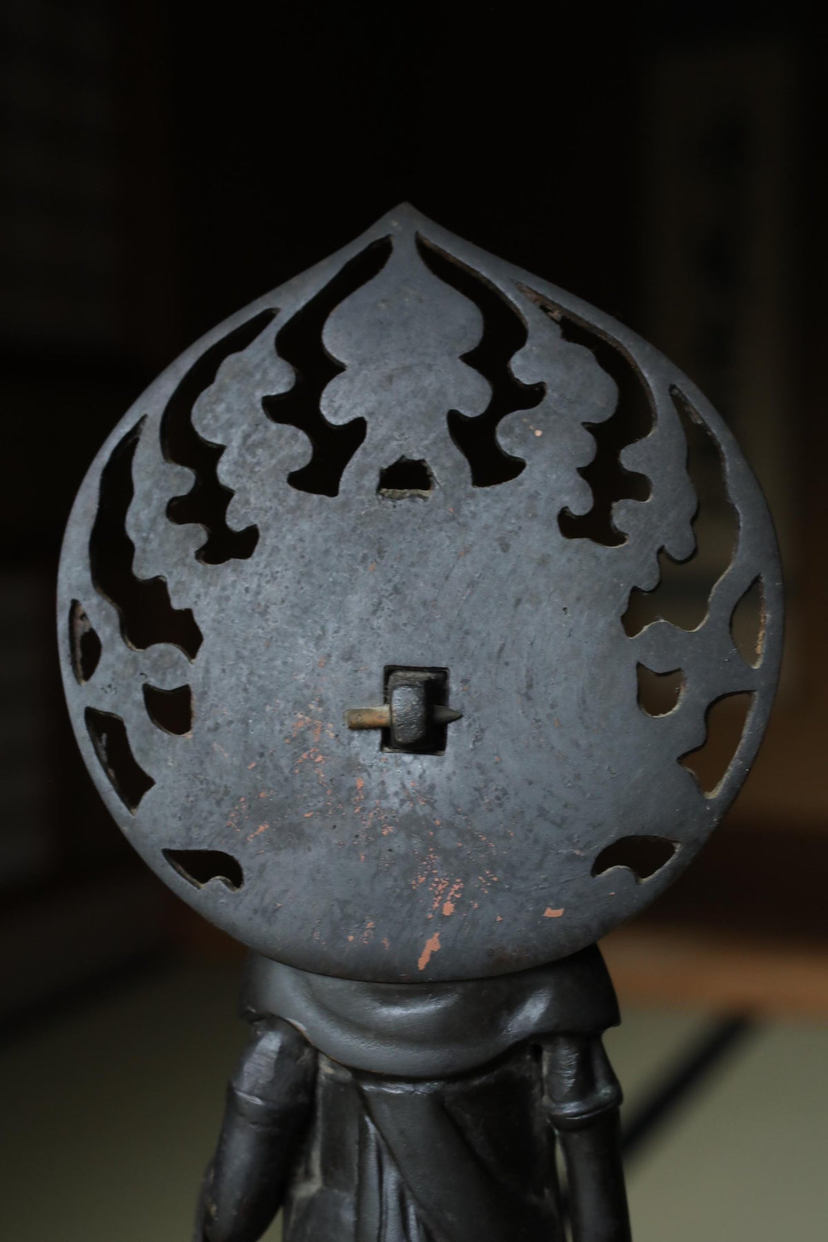 a close-up view of a metal object with a decorative design on its surface.