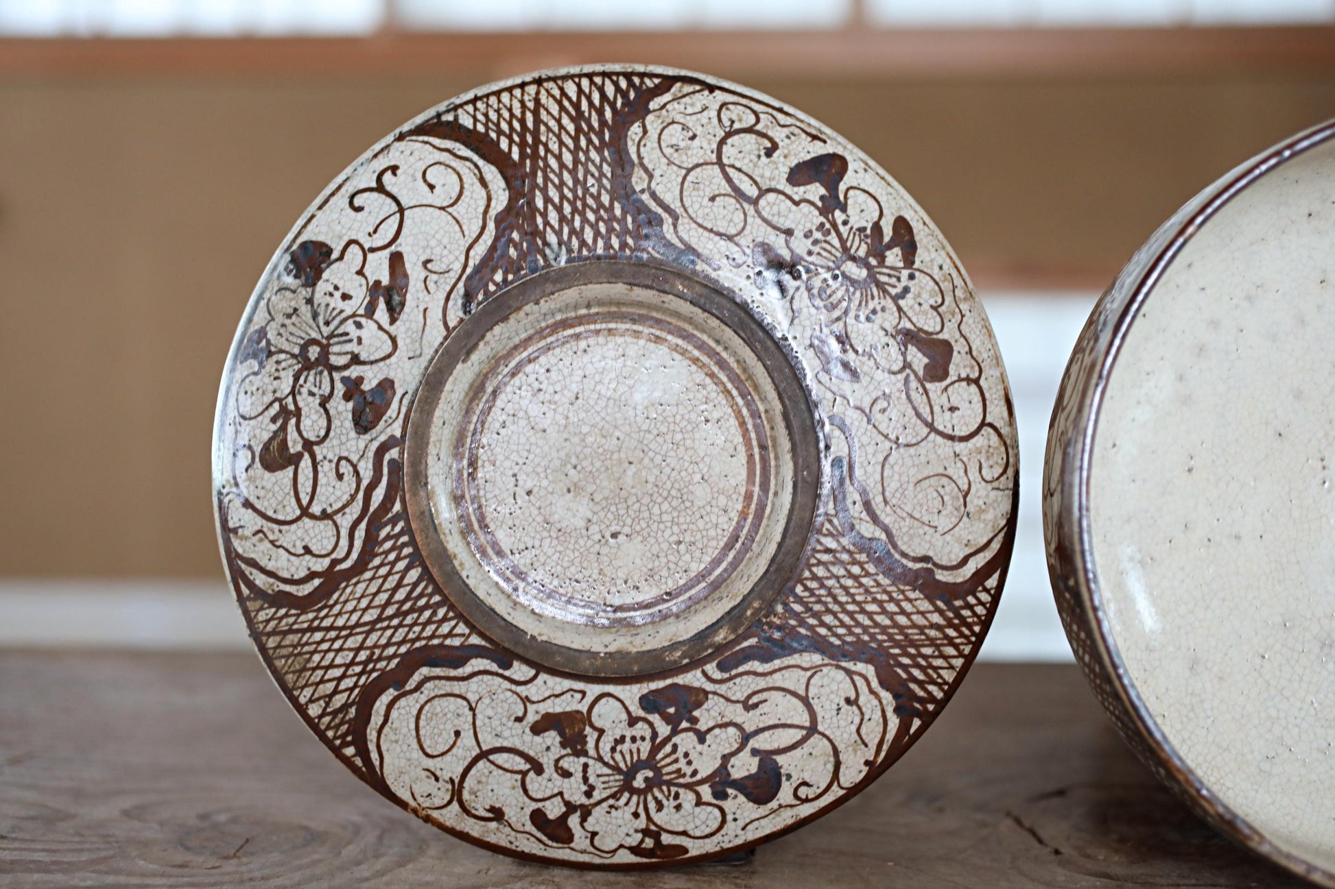 a close-up view of a decorative ceramic plate with intricate floral patterns and designs.