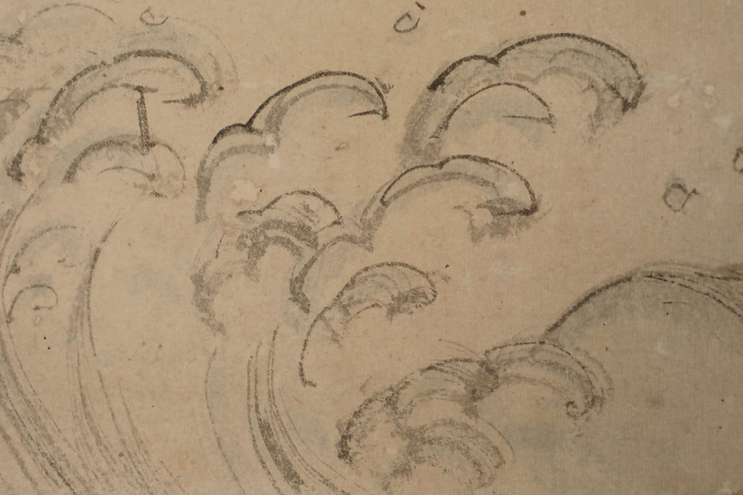 a close-up view of a sketch or drawing of a wave, with various lines and shapes used to create the wave-like pattern.