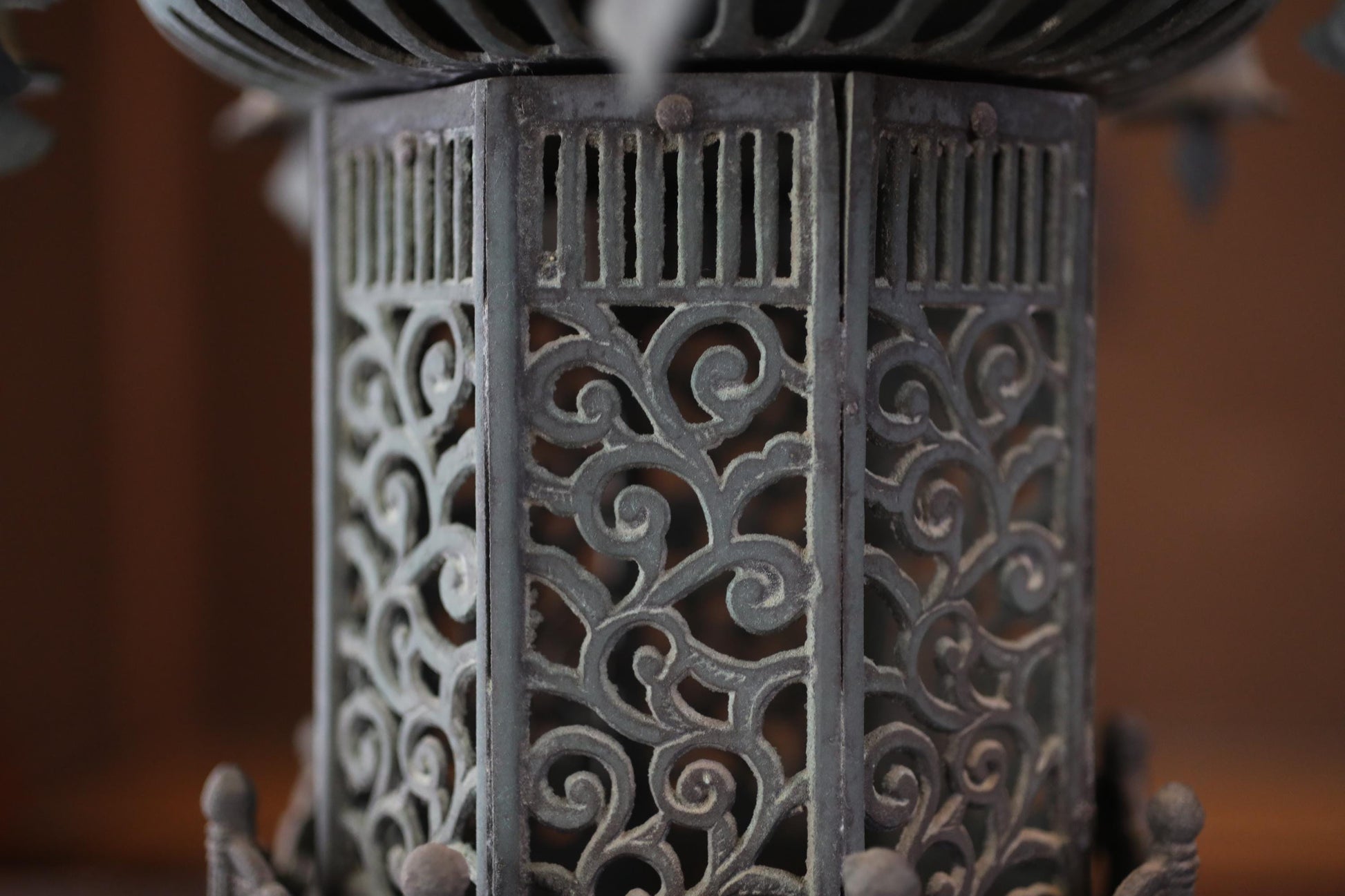 a close-up view of an ornate metal object with intricate, swirling patterns and designs.