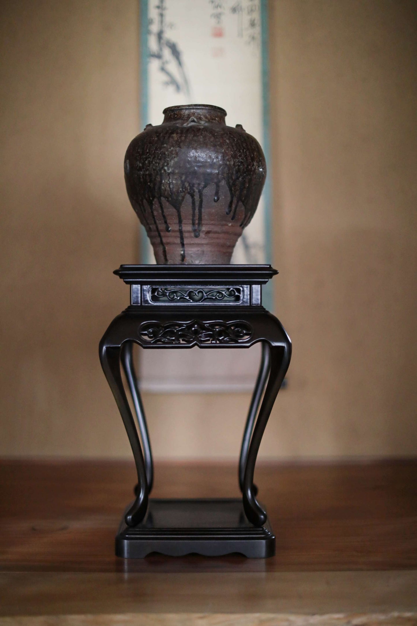 black wooden stand for art