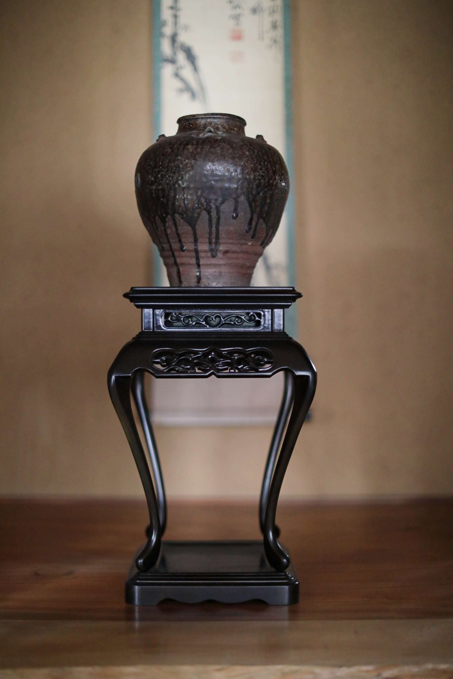 black wooden stand for art