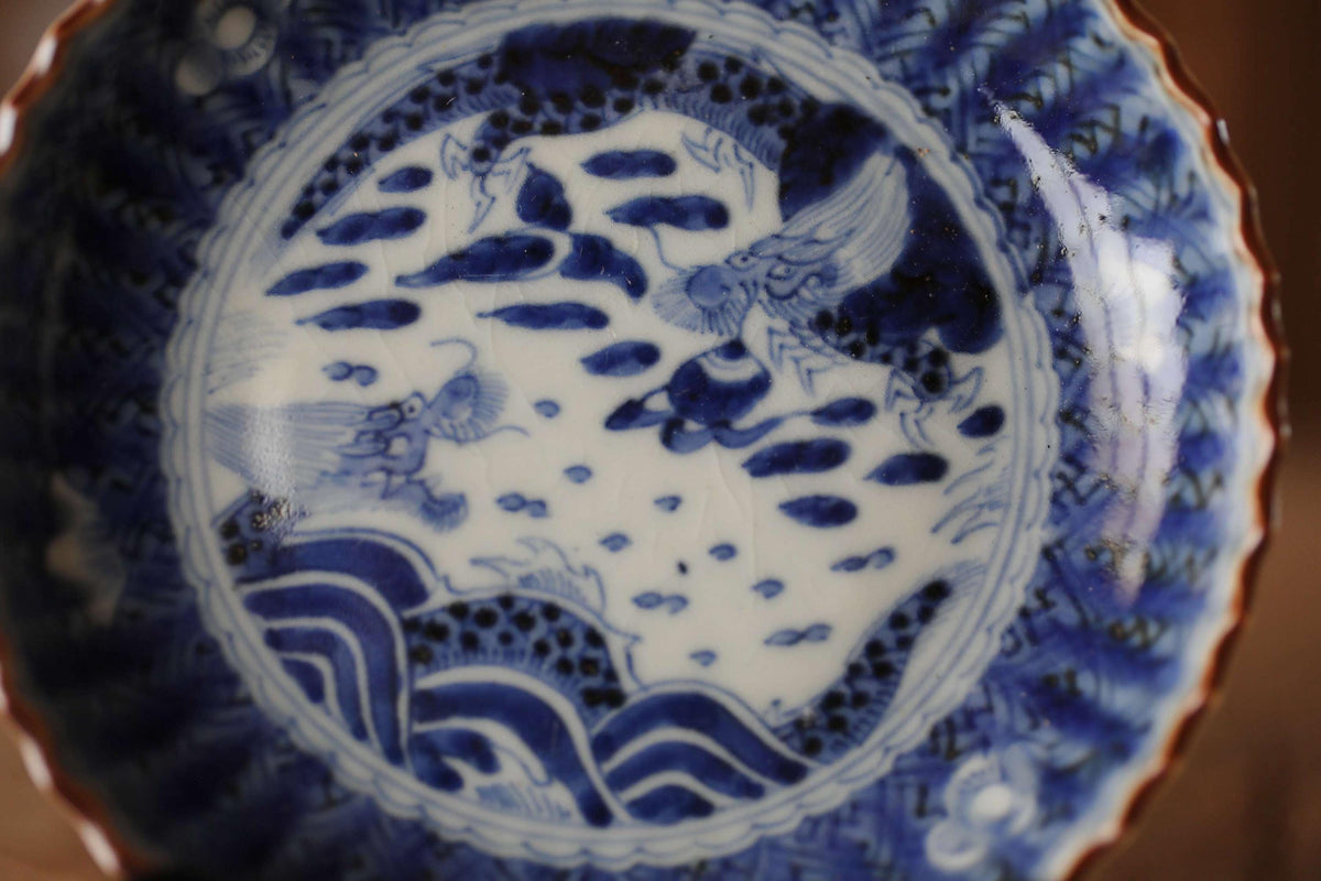 a close-up view of a decorative blue and white porcelain bowl with intricate patterns and designs.