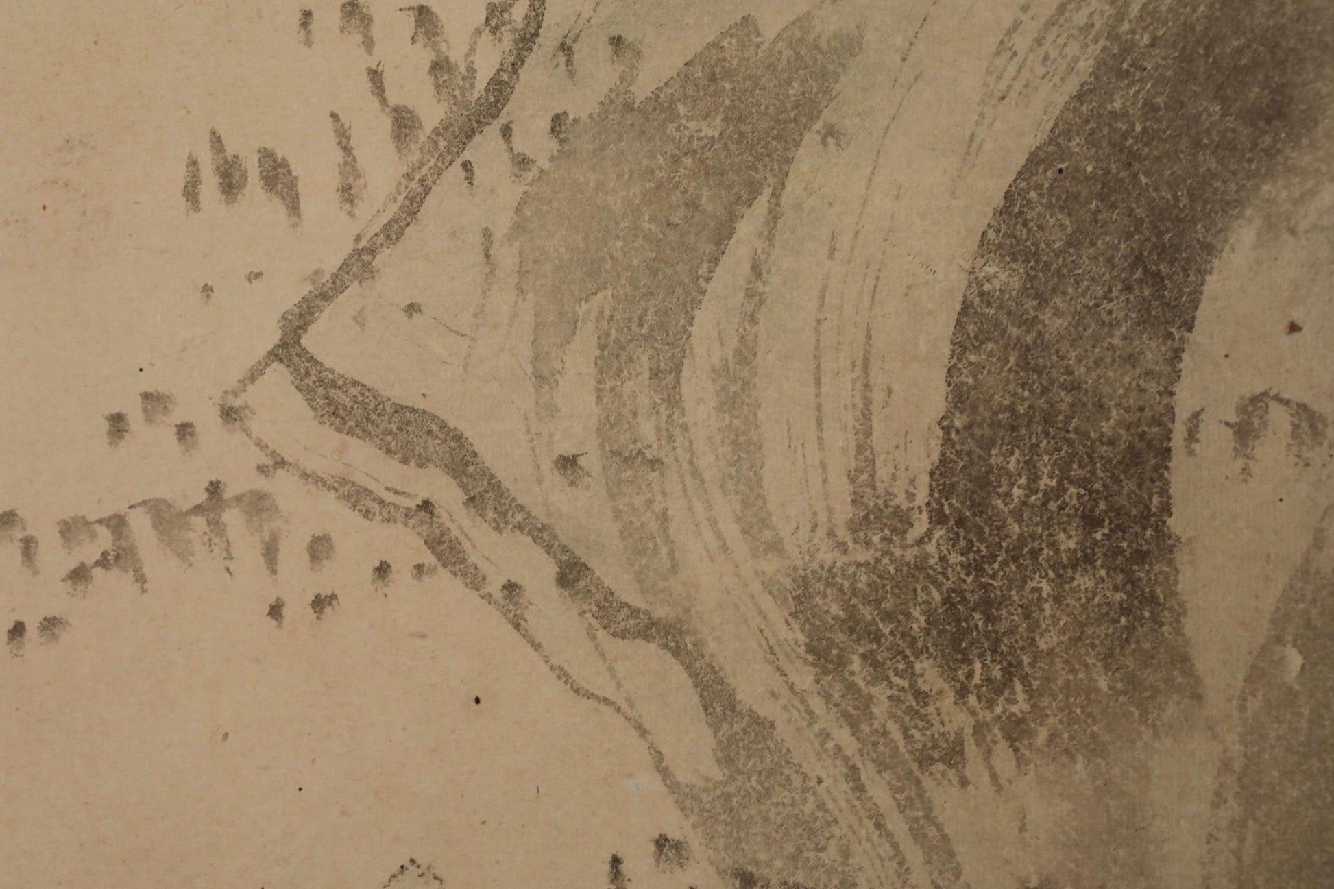 a close-up view of a textured surface with a pattern of dark and light lines, resembling a piece of art or a printed design.