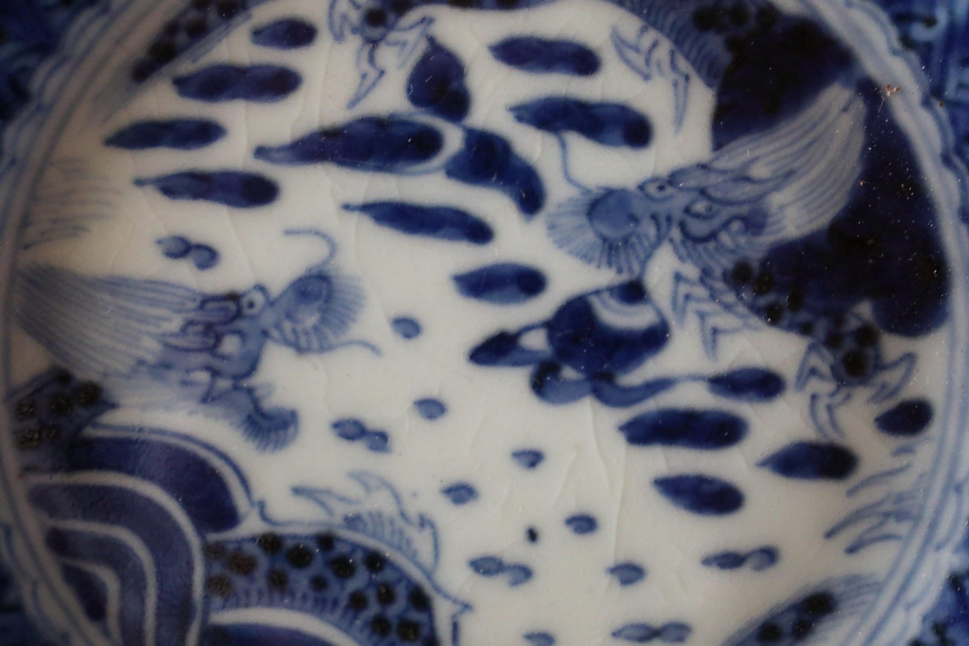 a close-up view of a decorative blue and white plate with intricate patterns and designs.