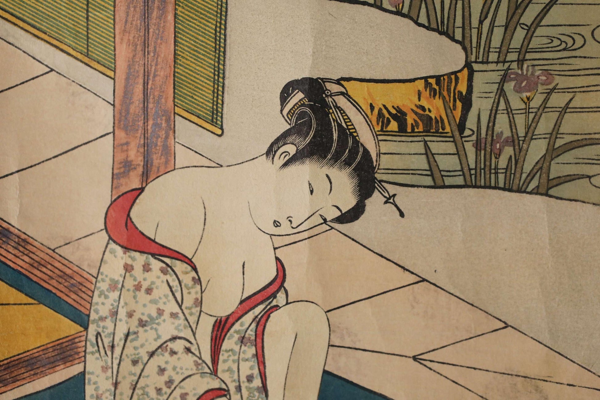 A close-up of a woman wearing a traditional Japanese kimono, with a serene expression on her face.