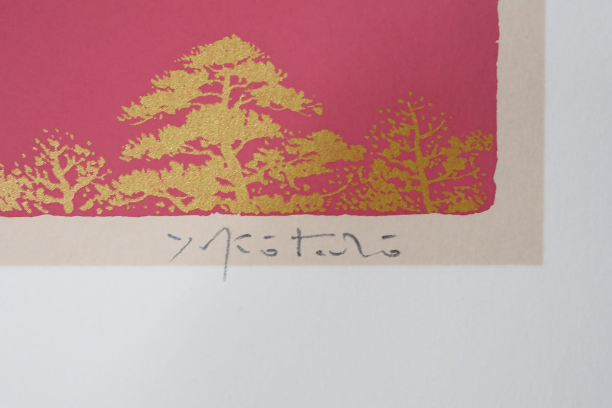 a close-up view of a red background with a gold tree design.