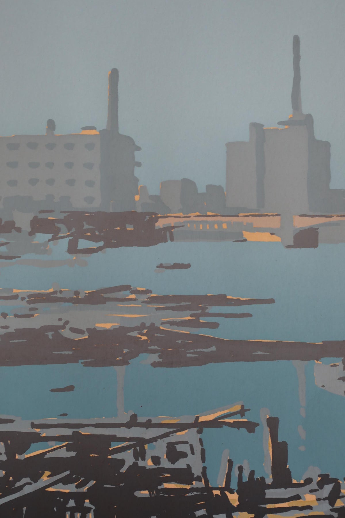 a cityscape with tall buildings and a body of water in the foreground.