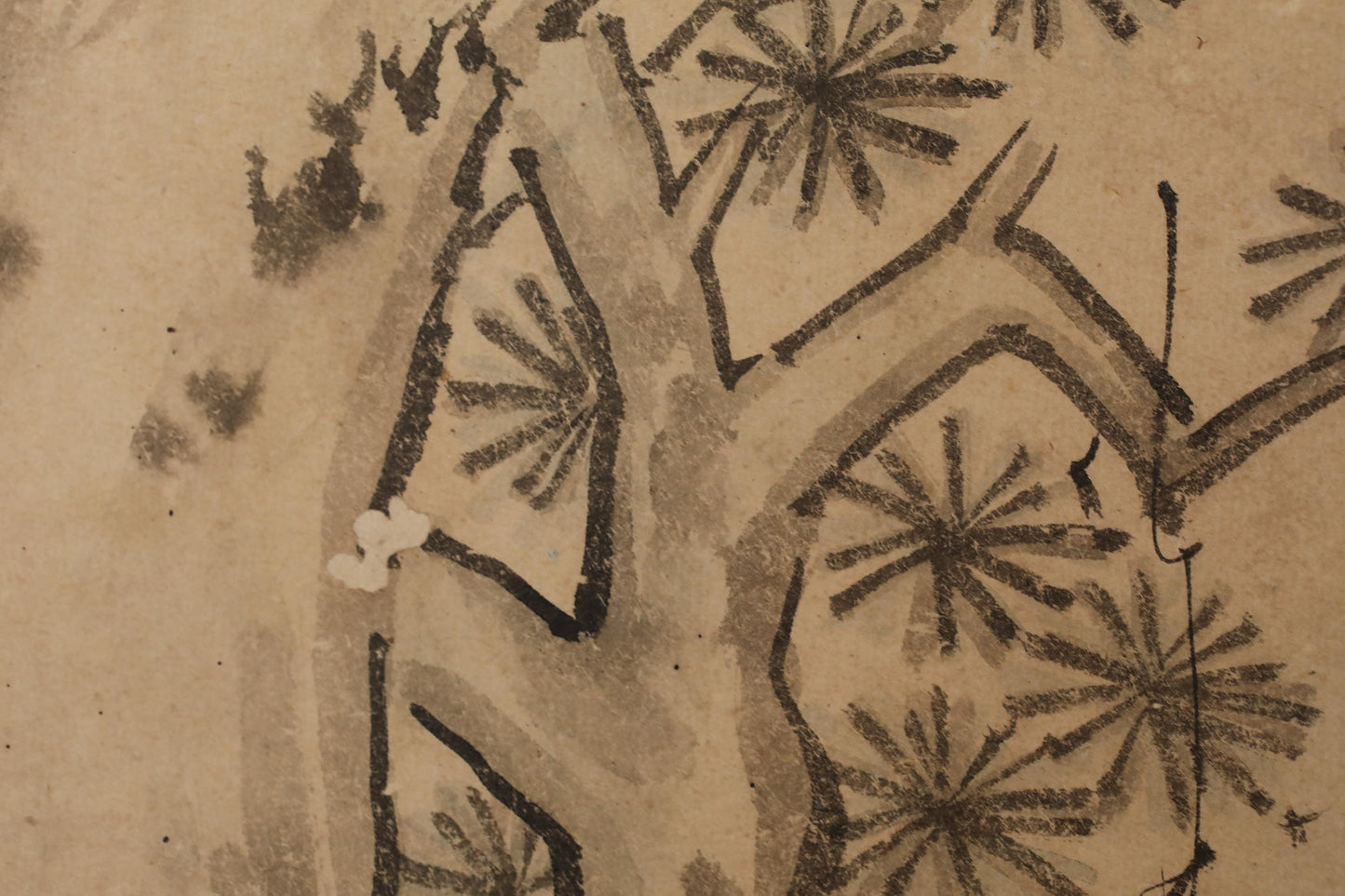The image is a close-up of a tree with intricate black and white brushstrokes, creating a detailed and textured appearance.