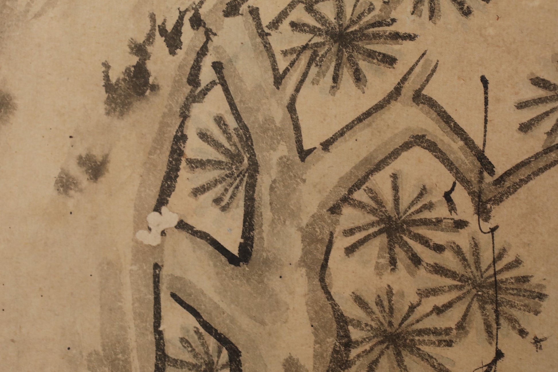 The image is a close-up of a tree with intricate black and white brushstrokes, creating a detailed and textured appearance.