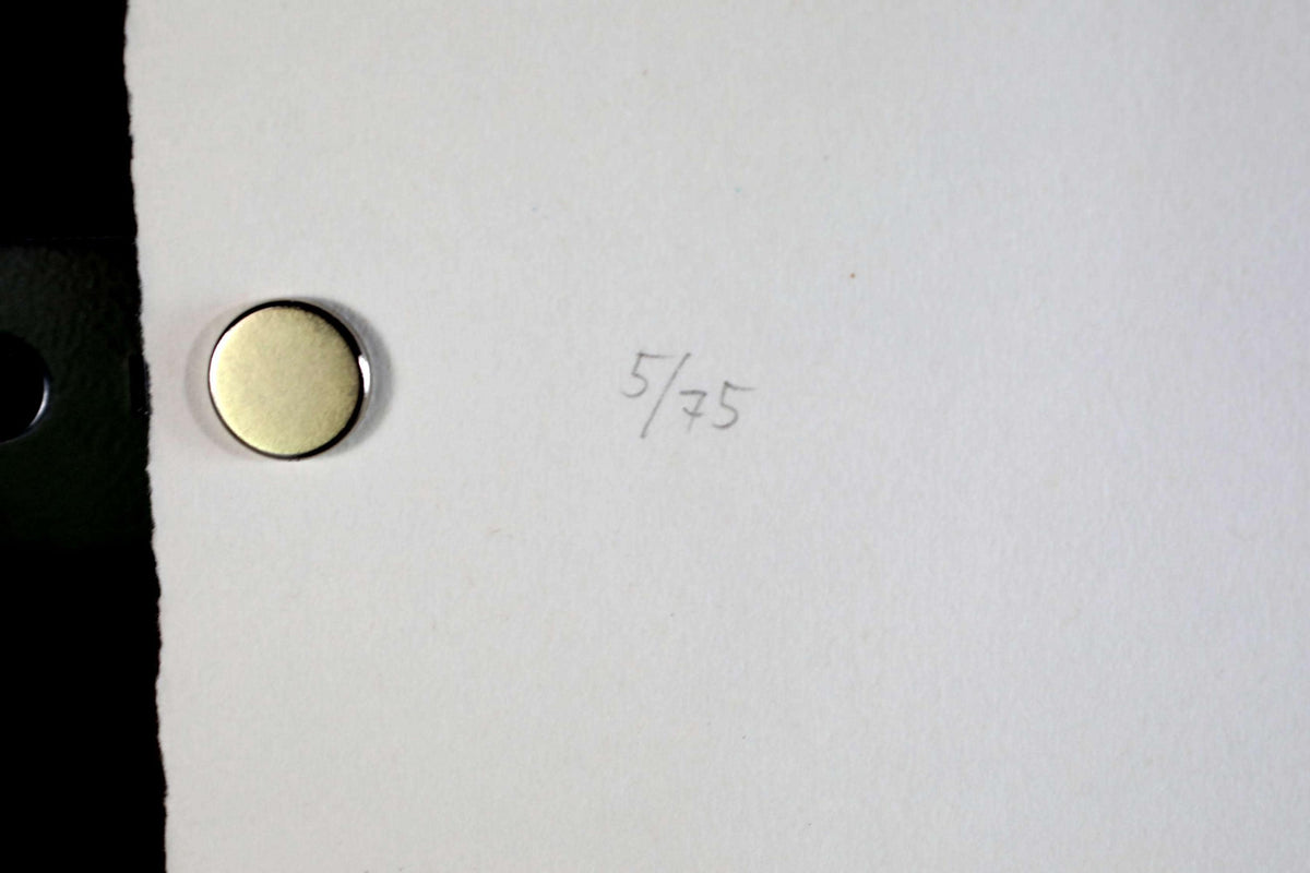 a white piece of paper with the number "5/75" written on it.