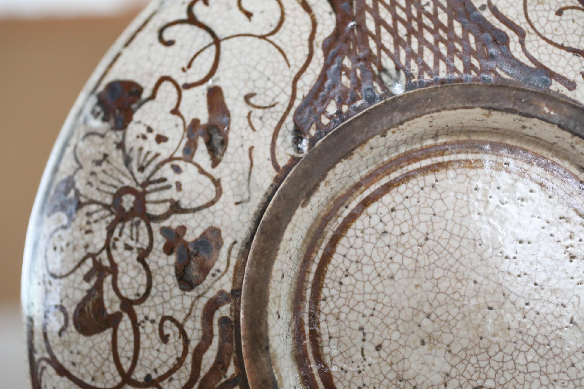 a close-up view of a decorative ceramic plate with intricate floral patterns and designs.