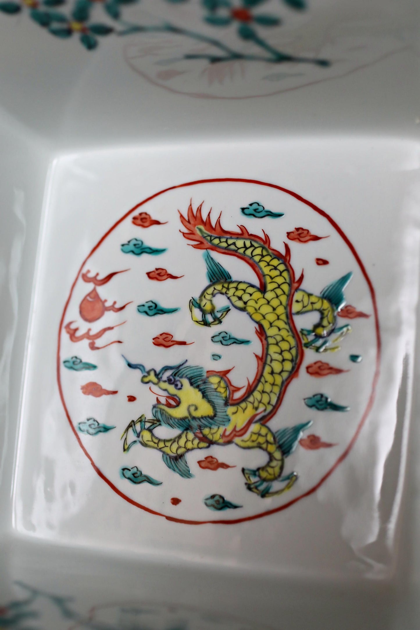 a vibrant, colorful dragon design on a white background.