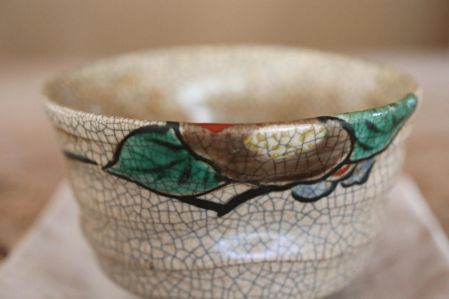 A close-up image of a ceramic bowl with a floral pattern on its surface.