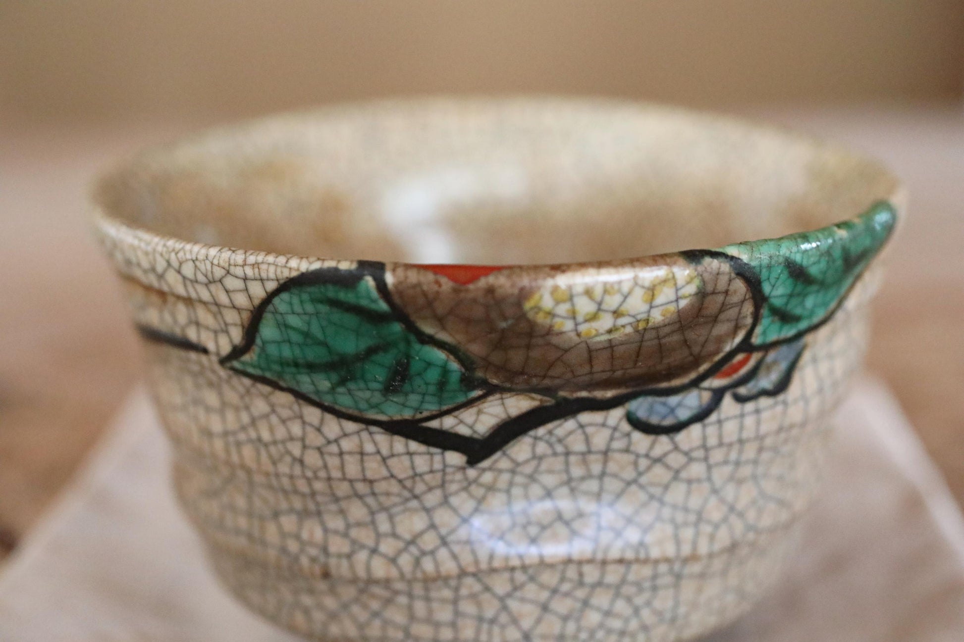 A close-up image of a ceramic bowl with a floral pattern on its surface.