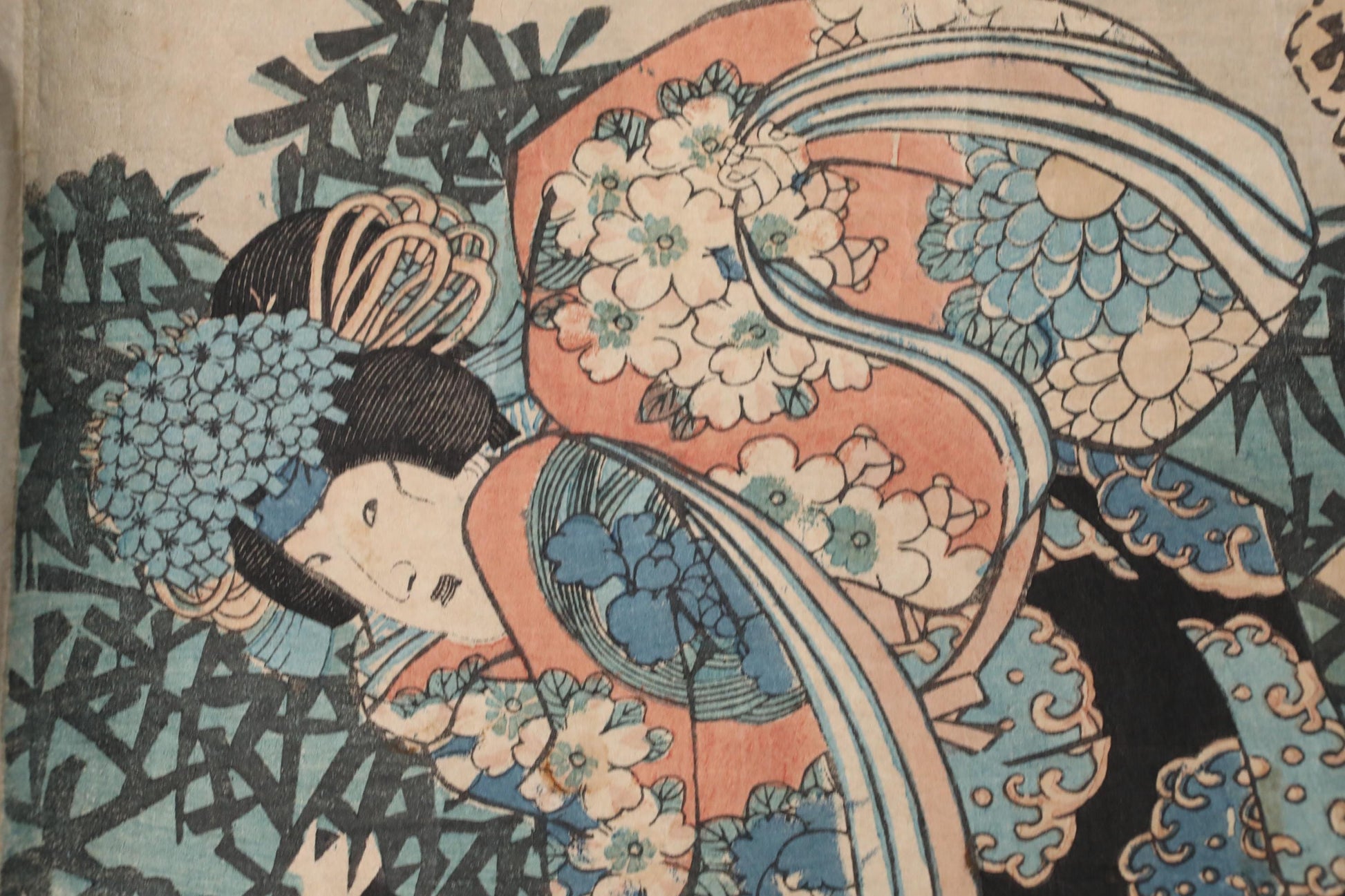 The image is a close-up of a colorful, intricate Japanese woodblock print featuring a woman with a floral headdress.