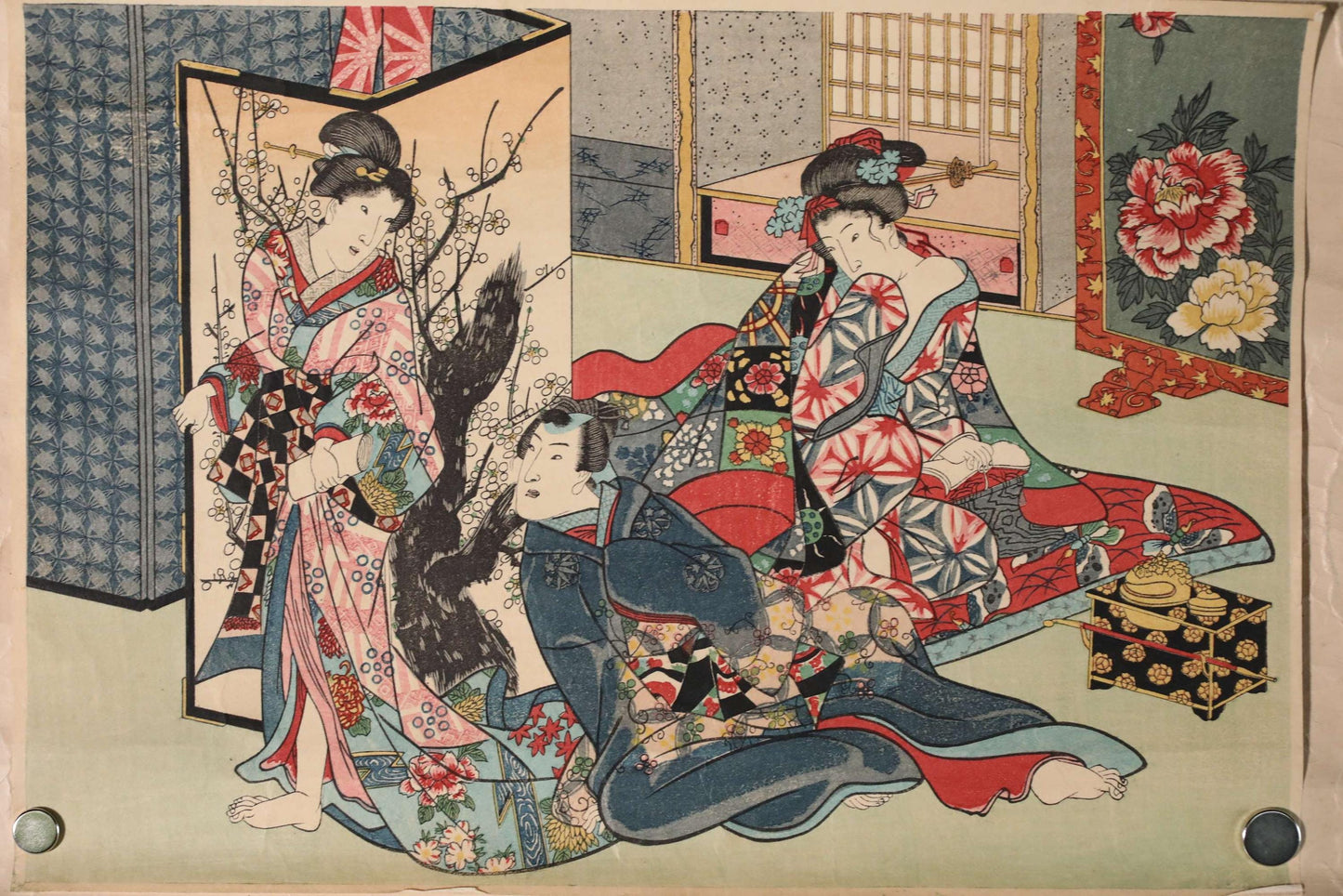 The image is a Japanese woodblock print featuring three women in traditional Japanese attire, including kimonos, sitting on a bed and surrounded by floral patterns and other decorative elements.