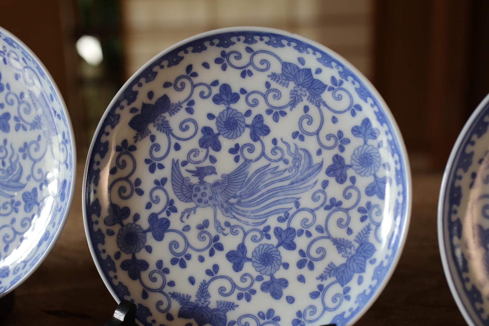 a close-up of a decorative blue and white plate with a floral pattern.