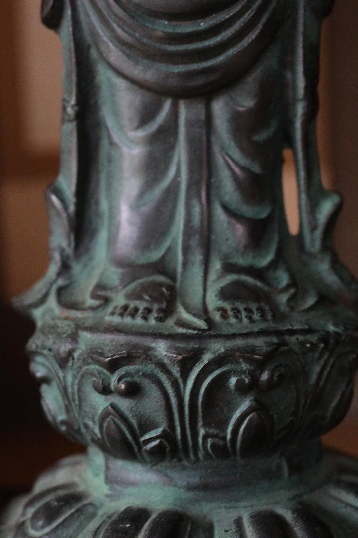 a close-up view of an ornate, intricately designed metal object, possibly a piece of art or a decorative item.