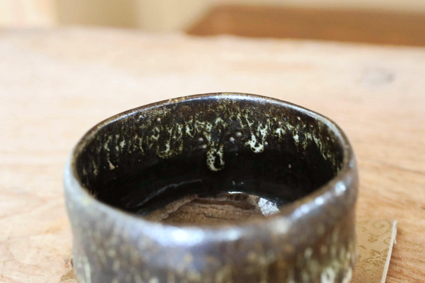 Japanese Raku Tea Bowl – Hand-Sculpted Chawan with Black Green Glaze | Ohi Kiln