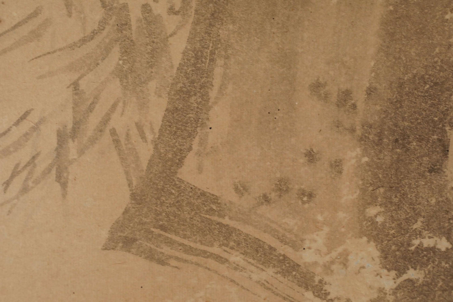 a close-up view of a textured surface with various marks and stains, including splatters and smudges. The overall appearance is somewhat worn and aged, with a somewhat dirty or stained look.