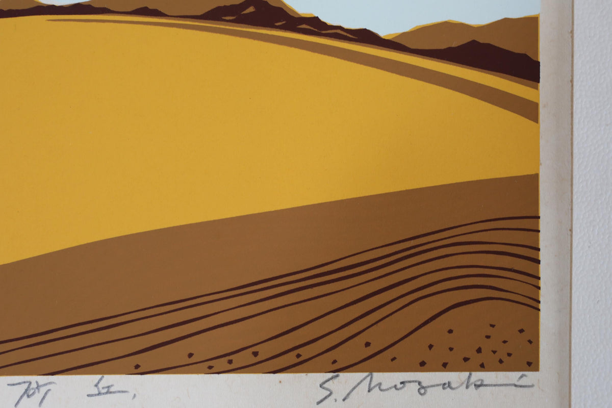 The image is a stylized landscape with a yellow field and mountains in the background.