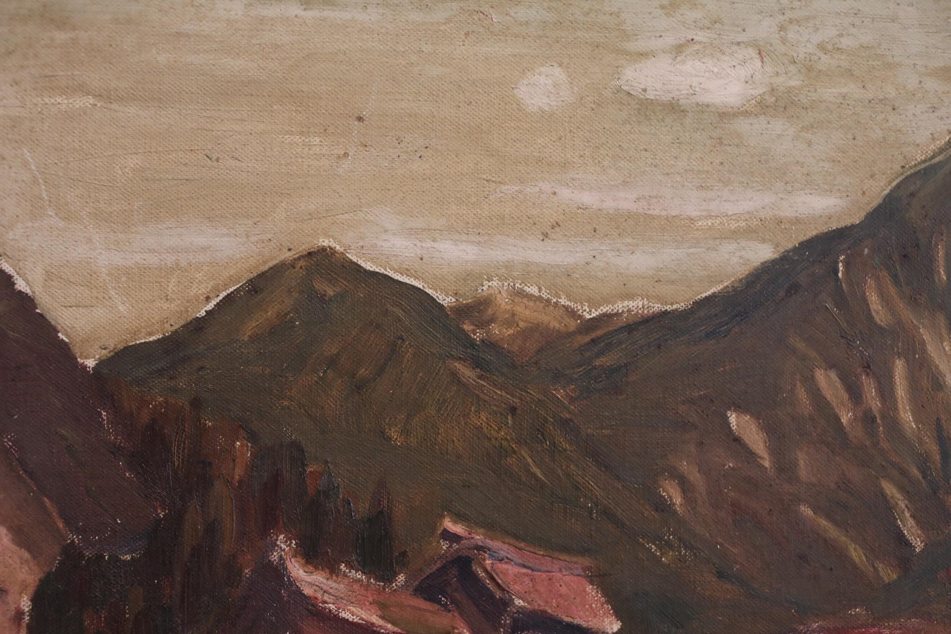 a mountainous landscape with a cloudy sky.