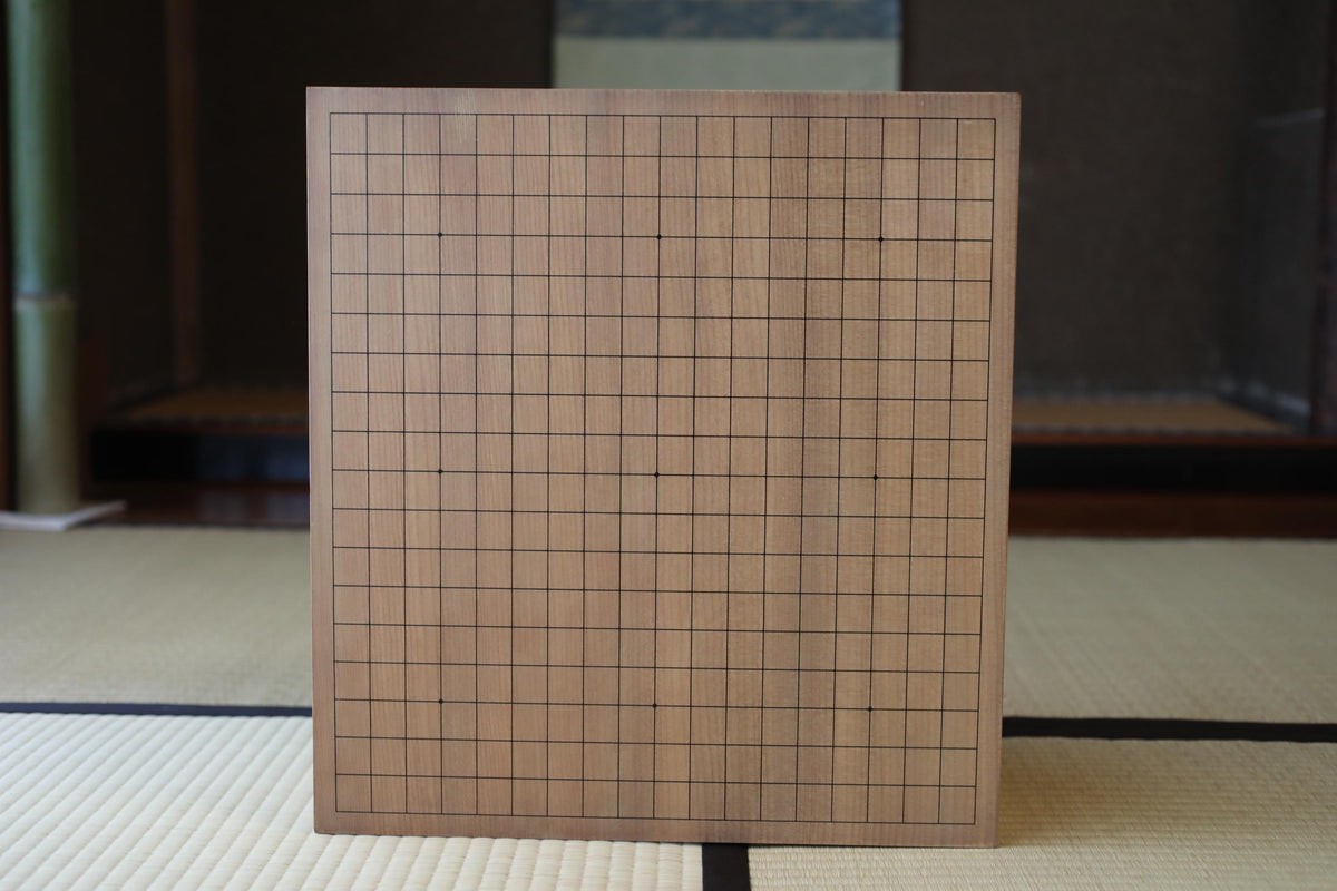 a wooden board with a grid pattern, placed on a tatami mat.