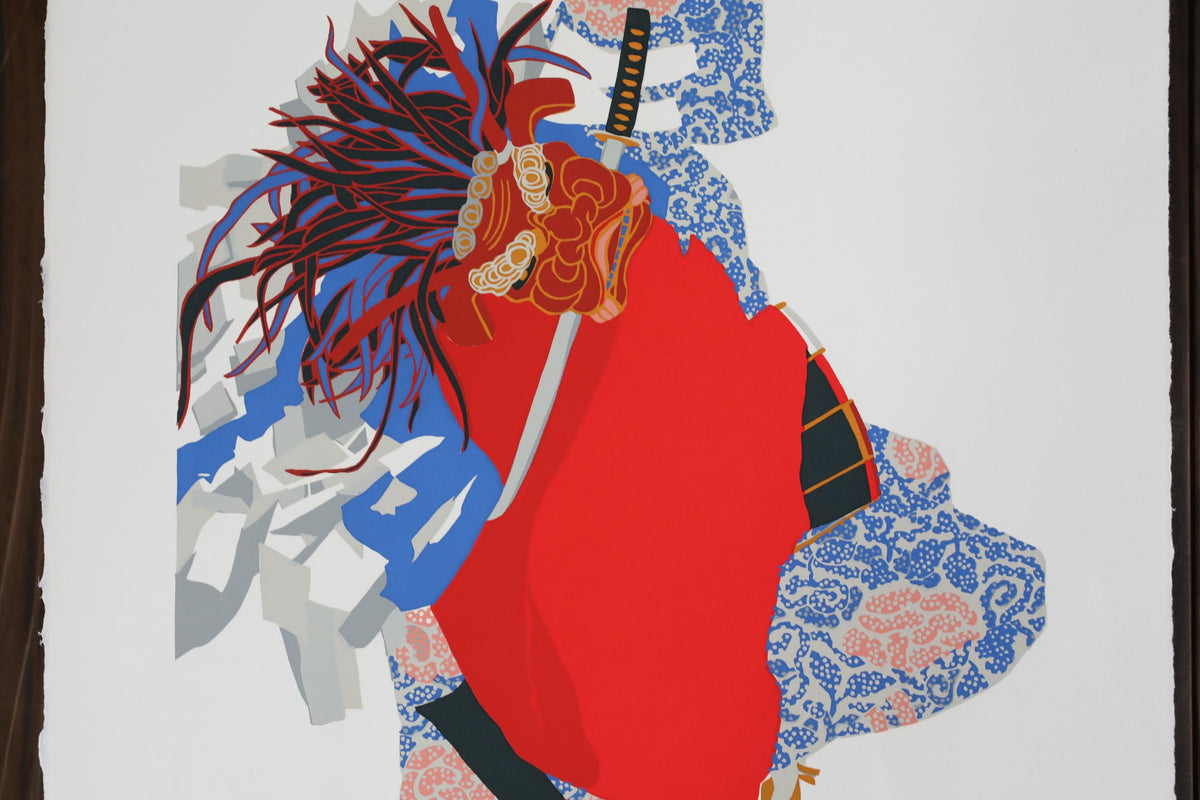 The image is a colorful abstract artwork featuring a red and blue patterned fabric with a large, stylized headdress or mask.