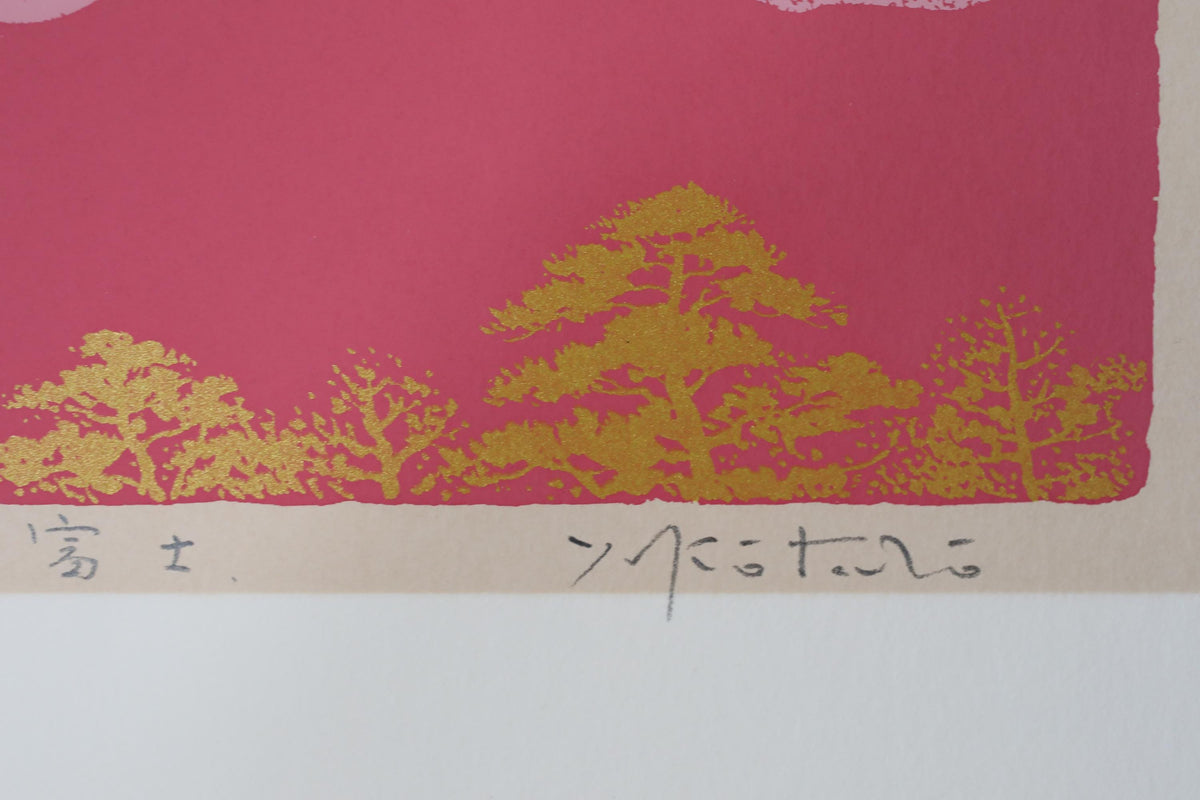 a close-up view of a vibrant red background with a repeating pattern of golden trees or foliage.