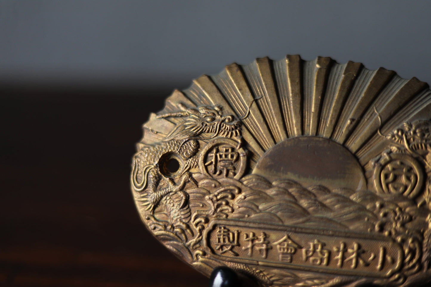 Japanese vintage metal plate for a safety box with relieves of sunrising on the sea, dragons and company name, H3.8xW5.5in