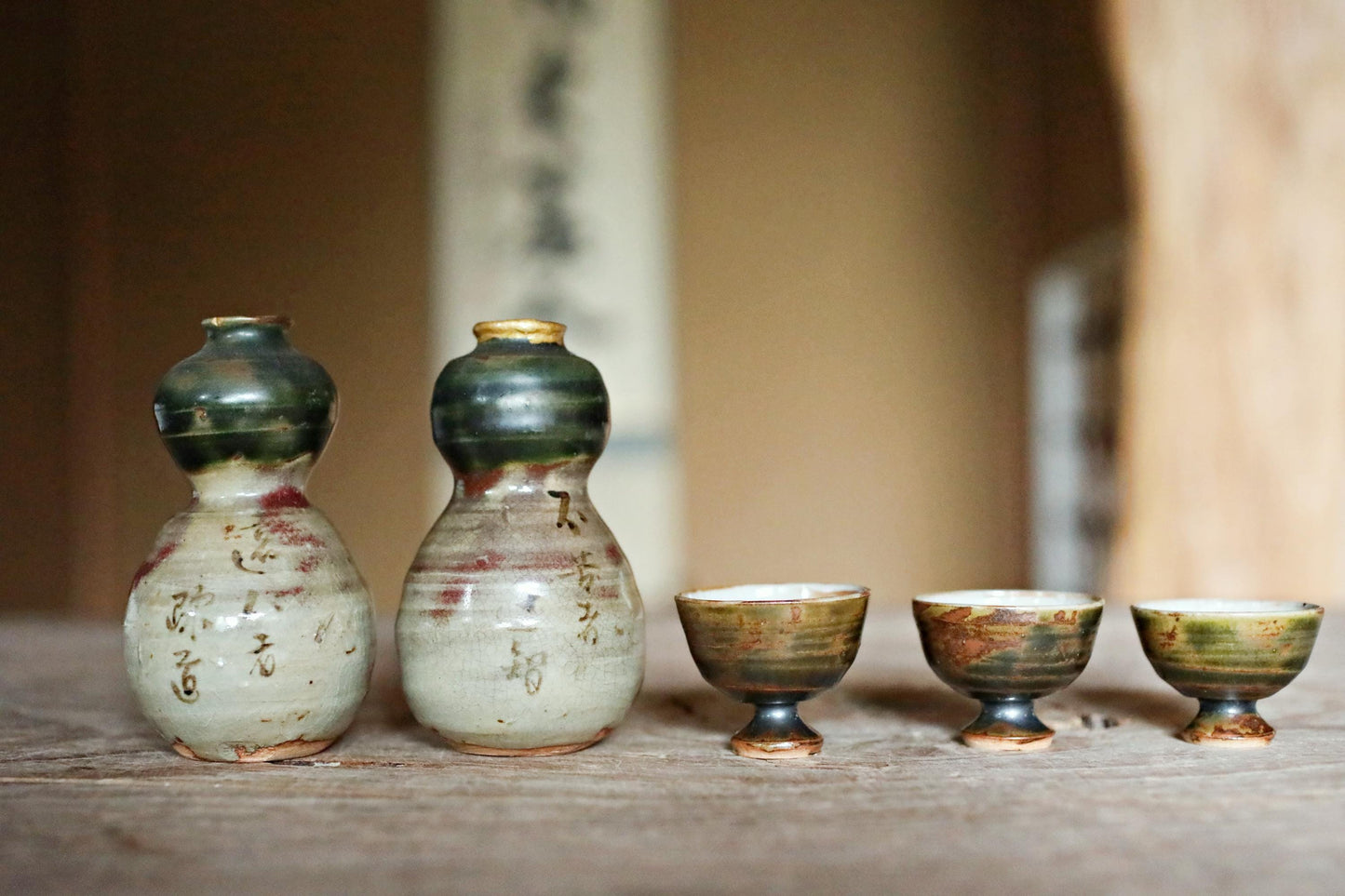 A pair of Kintsugi Tokkuri bottles and cups, Japanese antique porcelain sake bottle and cups with old words in Kanji  H3.9in/10cm