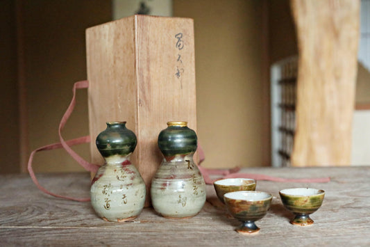 A pair of Kintsugi Tokkuri bottles and cups, Japanese antique porcelain sake bottle and cups with old words in Kanji  H3.9in/10cm